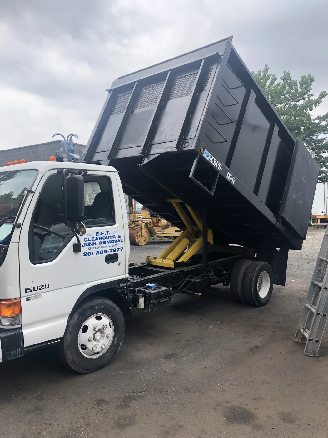 Truck with its hydraulic dump body raised
