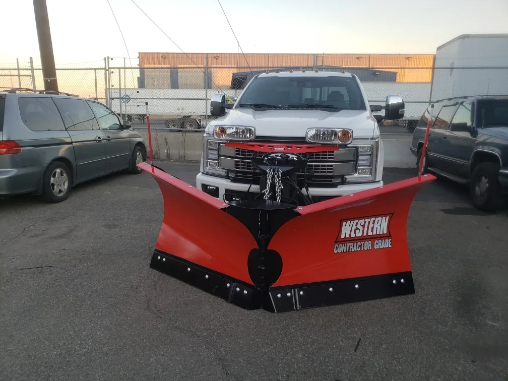 Truck fitted with a red snow plow