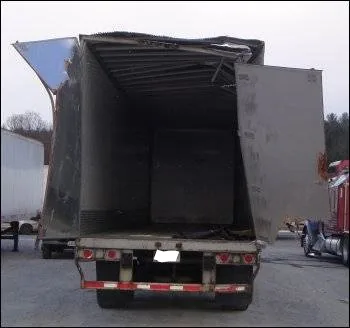 Reference image of a damaged trailer body
